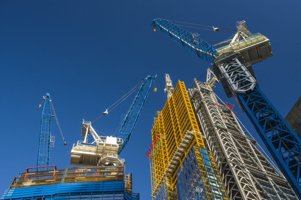 Cranes constructing a tall building