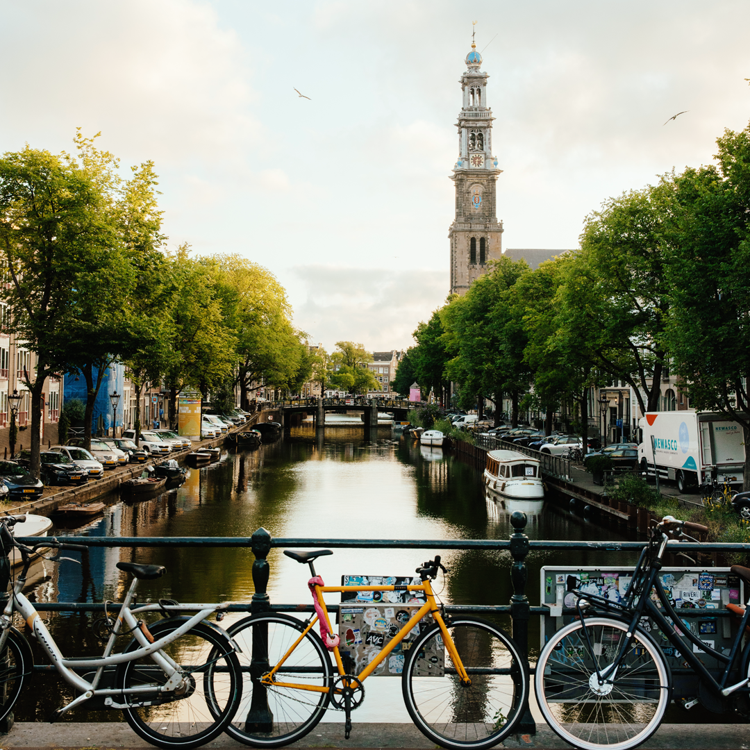 Bicycles by a serene canal scene