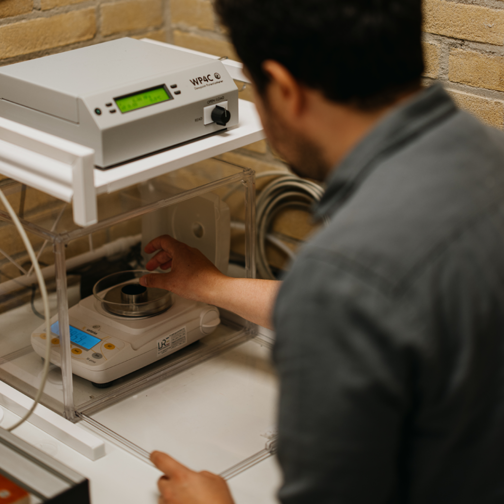Person using laboratory equipment for analysis